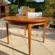 Round extendable teak dining table from the 60s
