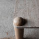 Square bass table in travertine and solid wood - 70s