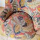 Small "madame" toad chair, vintage, upholstered in multicoloured floral fabric.