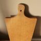 Wooden cutting board with handle