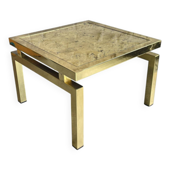 Coffee table in gold metal and gold leaf.