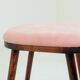 Bar stools matching the vintage style, in pink corduroy.