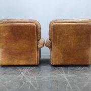 Paire de fauteuils lounge en cuir buffle cognac Arcon Italia