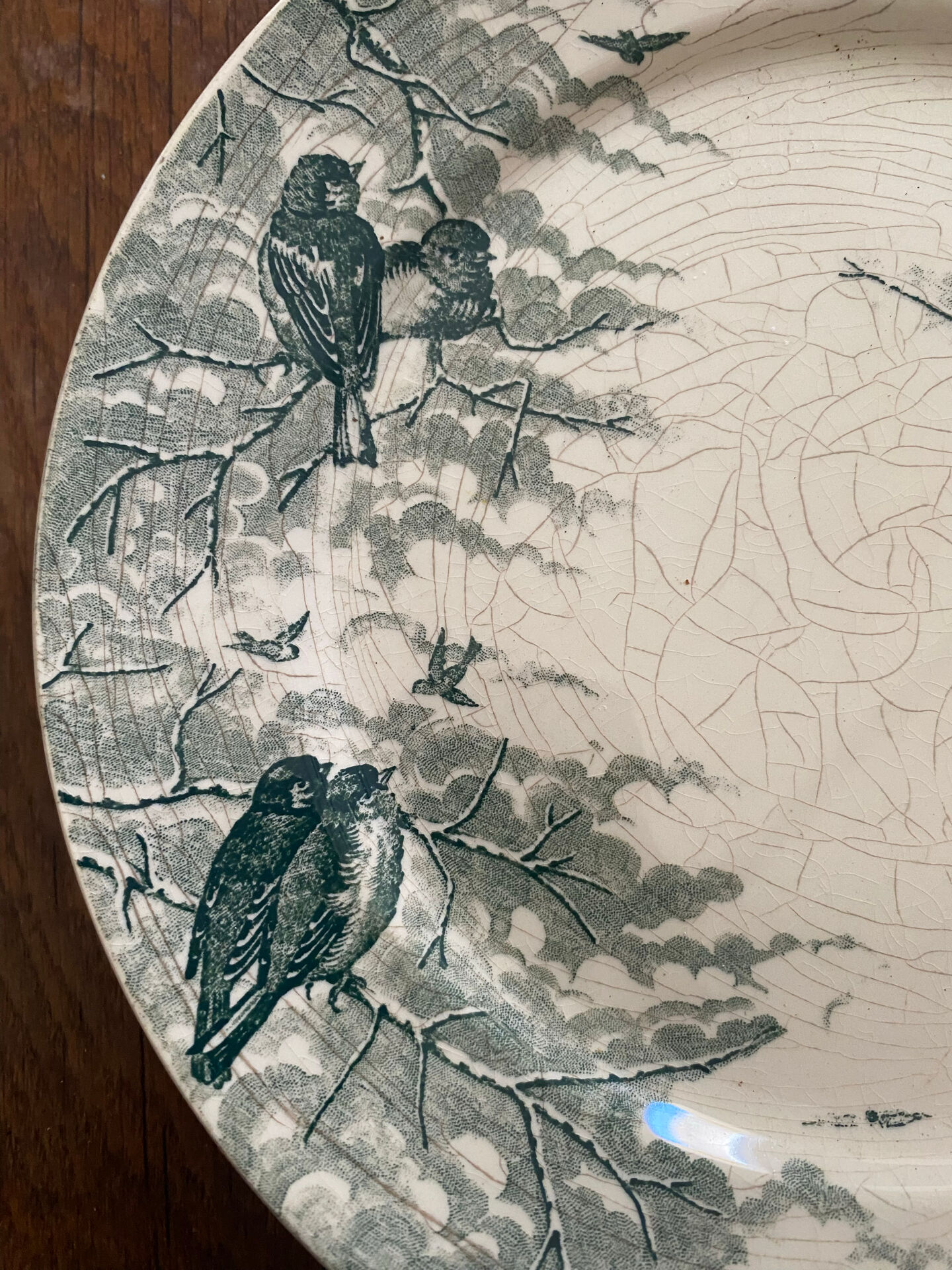 Plate on a presentation stand stamped U&C Sarreguemines Neige.
