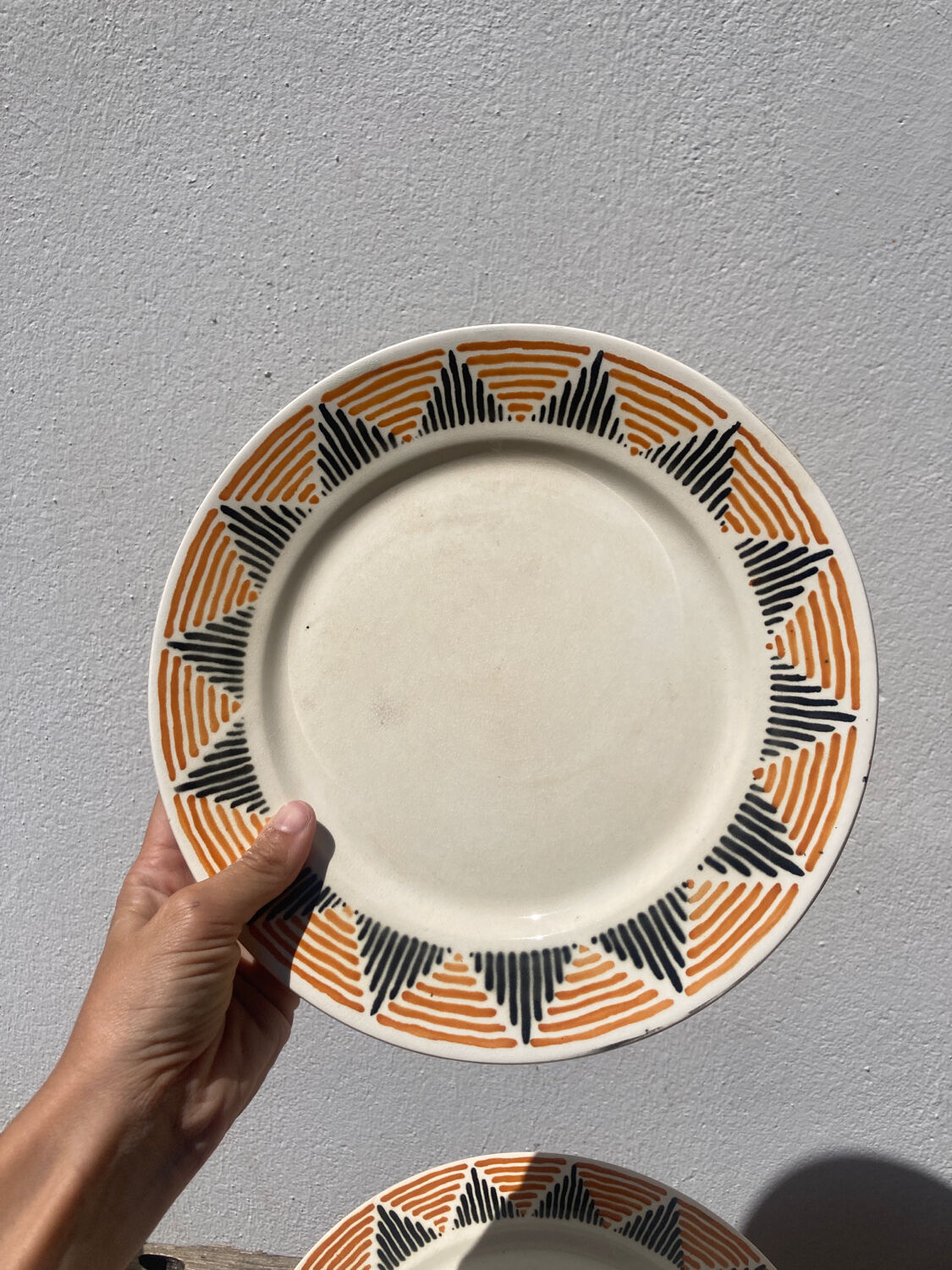 12 flat plates in yellow earthenware Badonviller
