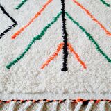 White wool Berber rug with fluorescent orange green patterns
