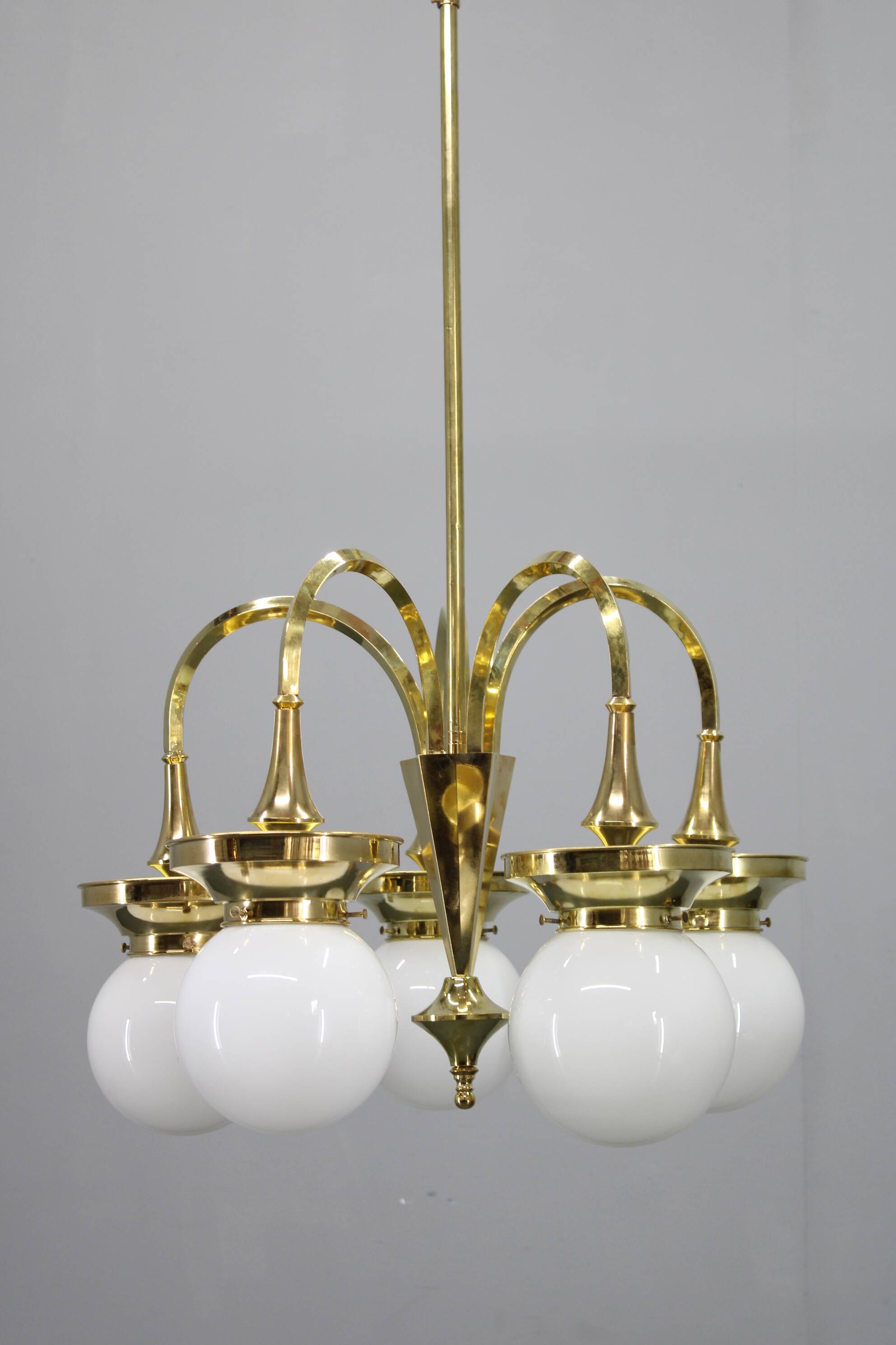 1930s Czechoslovak Art Deco brass chandelier with five opaline glass globes