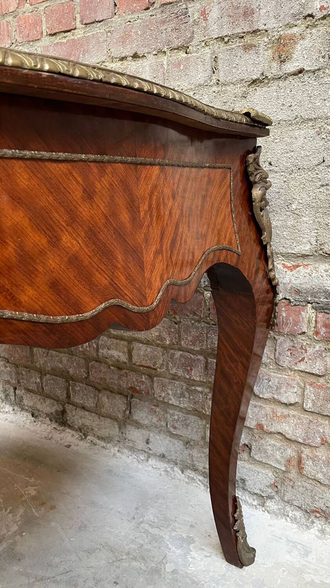 Antique French-style desk with green leather top and bronze mounts