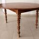 Round solid oak table with extensions, cabinetmaker's sliding mechanism,