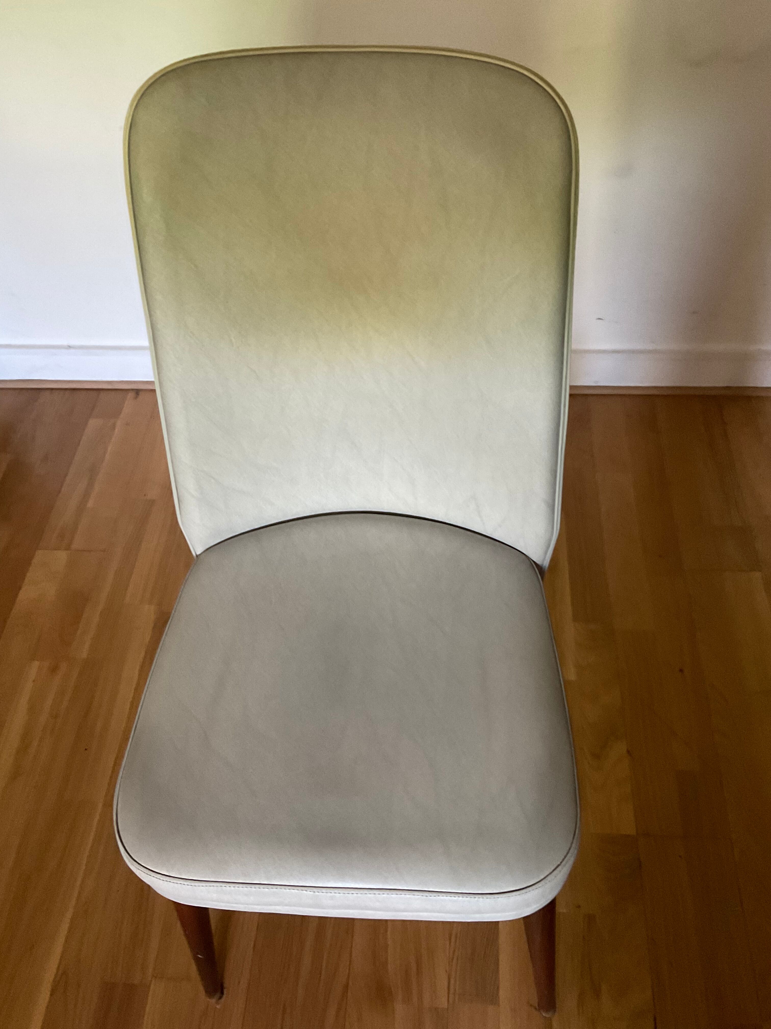 Pair of vintage mahogany and skai chairs