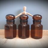 Trio round brown apothecary bottles