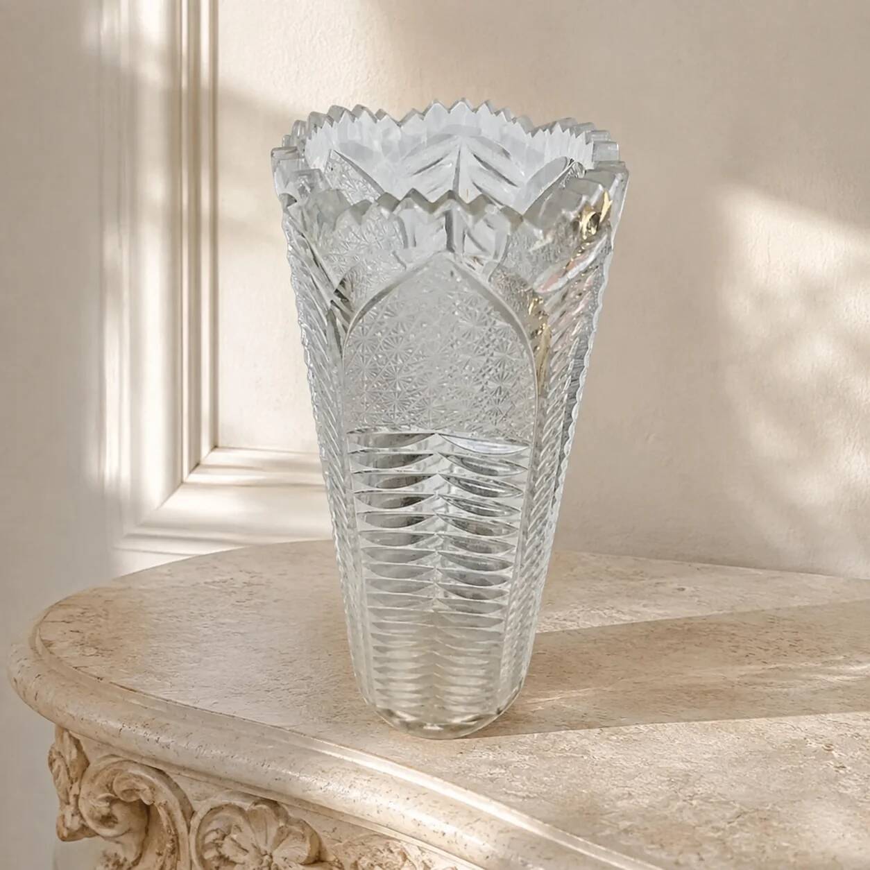 Antique cut crystal vase with a scalloped edge, decorated with palmettes.