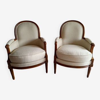 Paire de fauteuils bergères de style Louis XVI