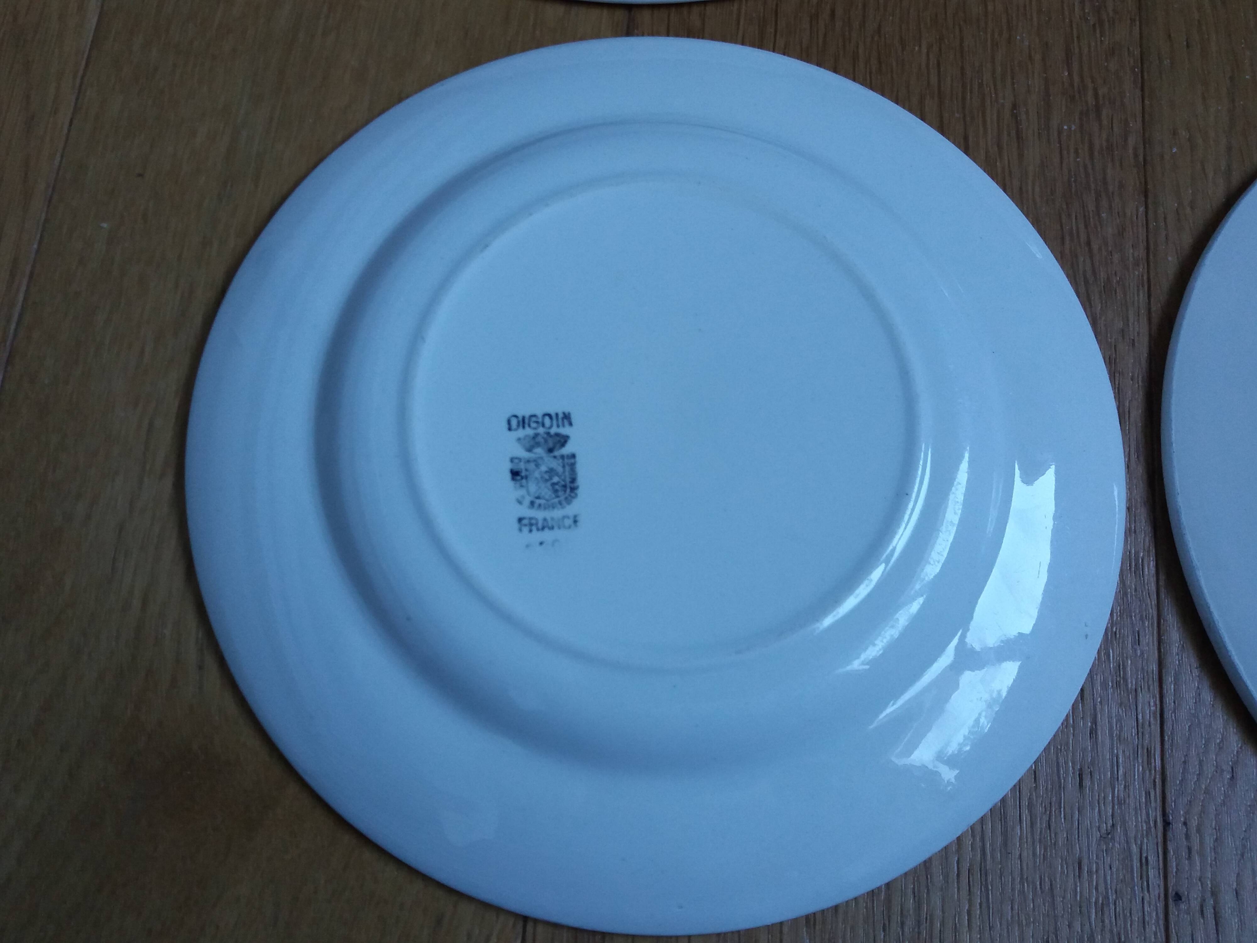 Old green and blue mismatched plates from Digoin, Salins, Moulin des Loups