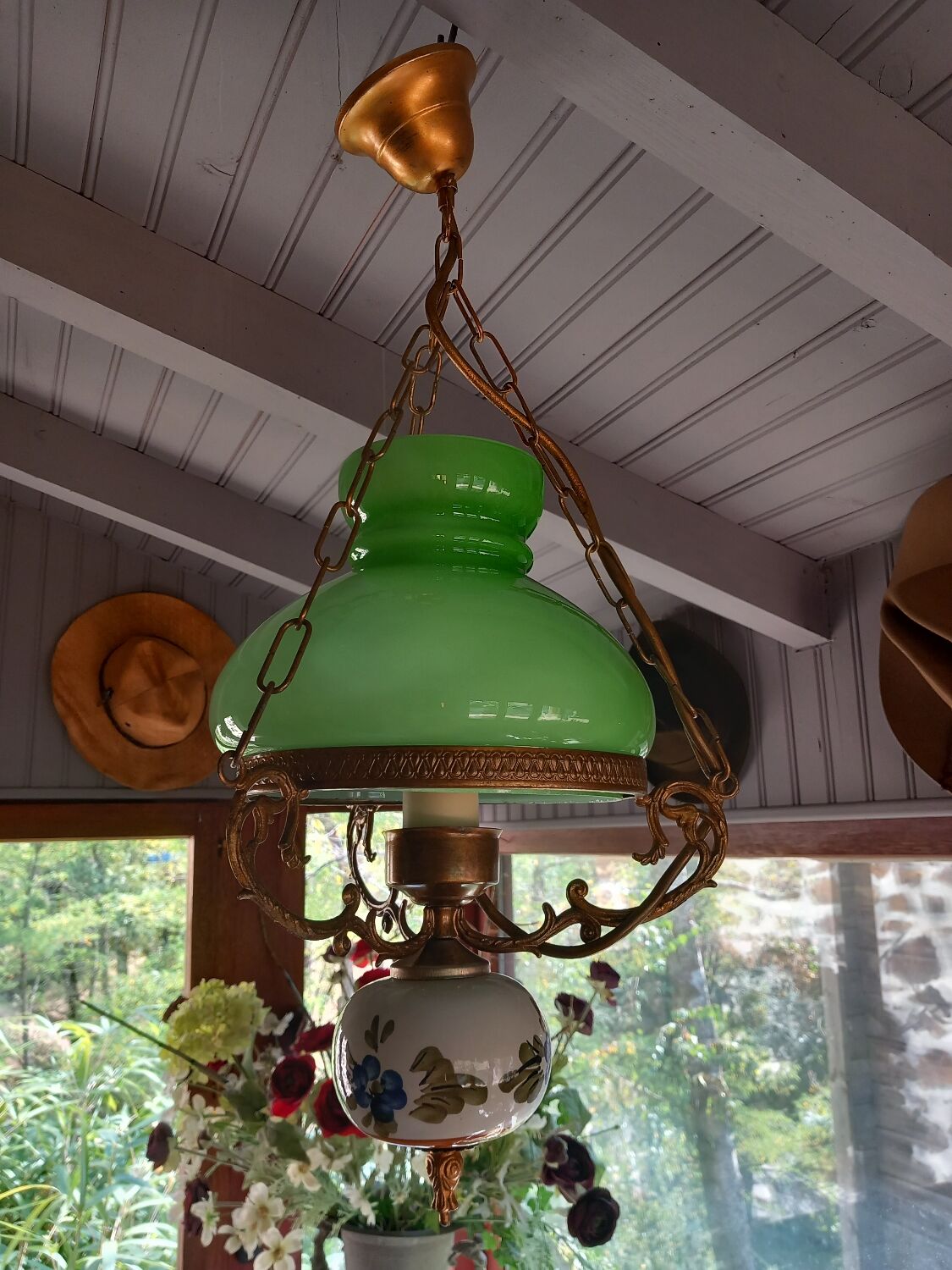 Old green opaline chandelier, gold metal and earthenware