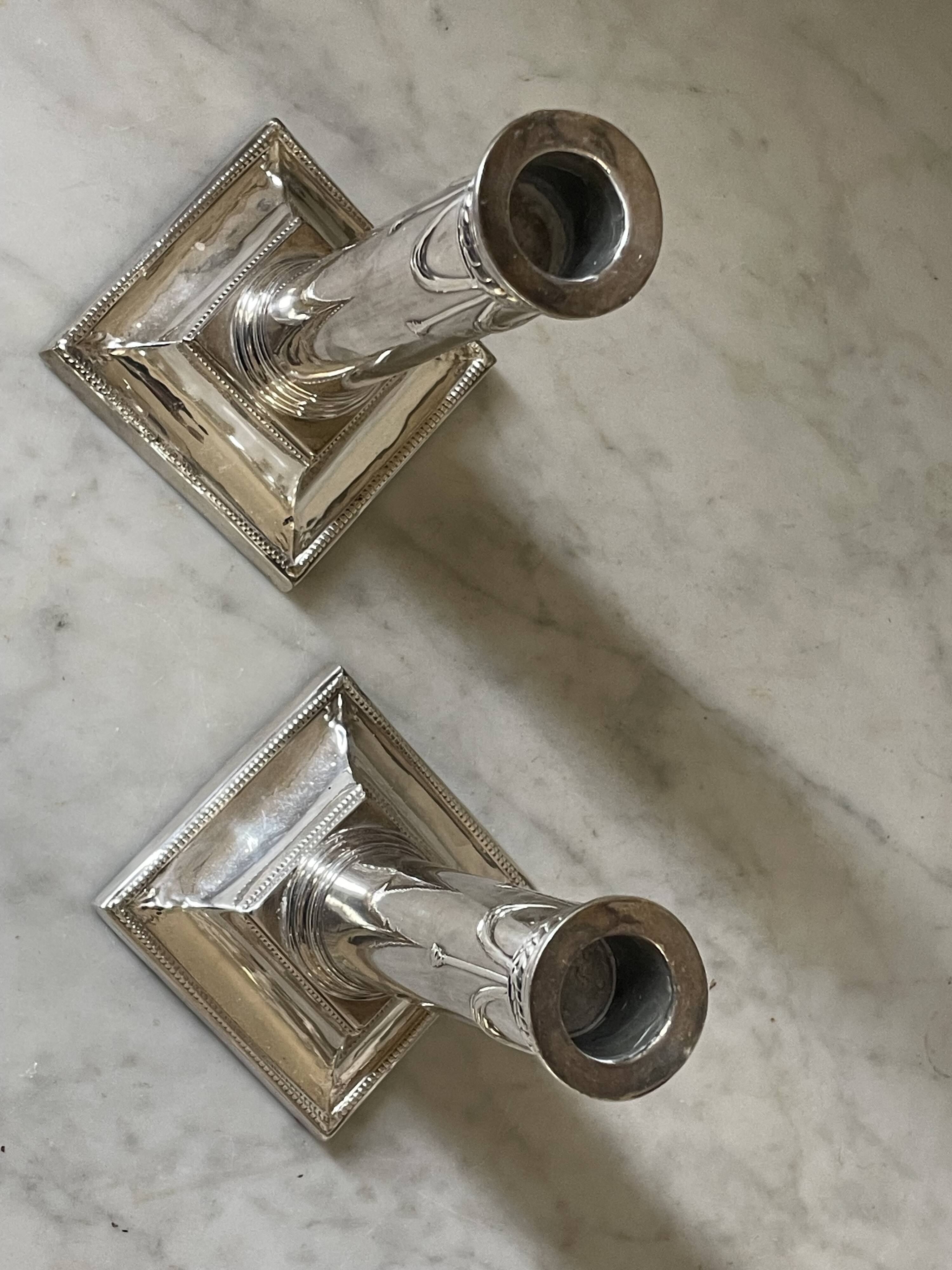pair of Victorian style silver-plated candlesticks