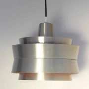 Carl Thore's Trava lamp in aluminium with an orange lacquered interior.