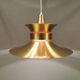 Large hanging lamp, made of brass-coloured aluminium with red and white contrast lacquer inside.