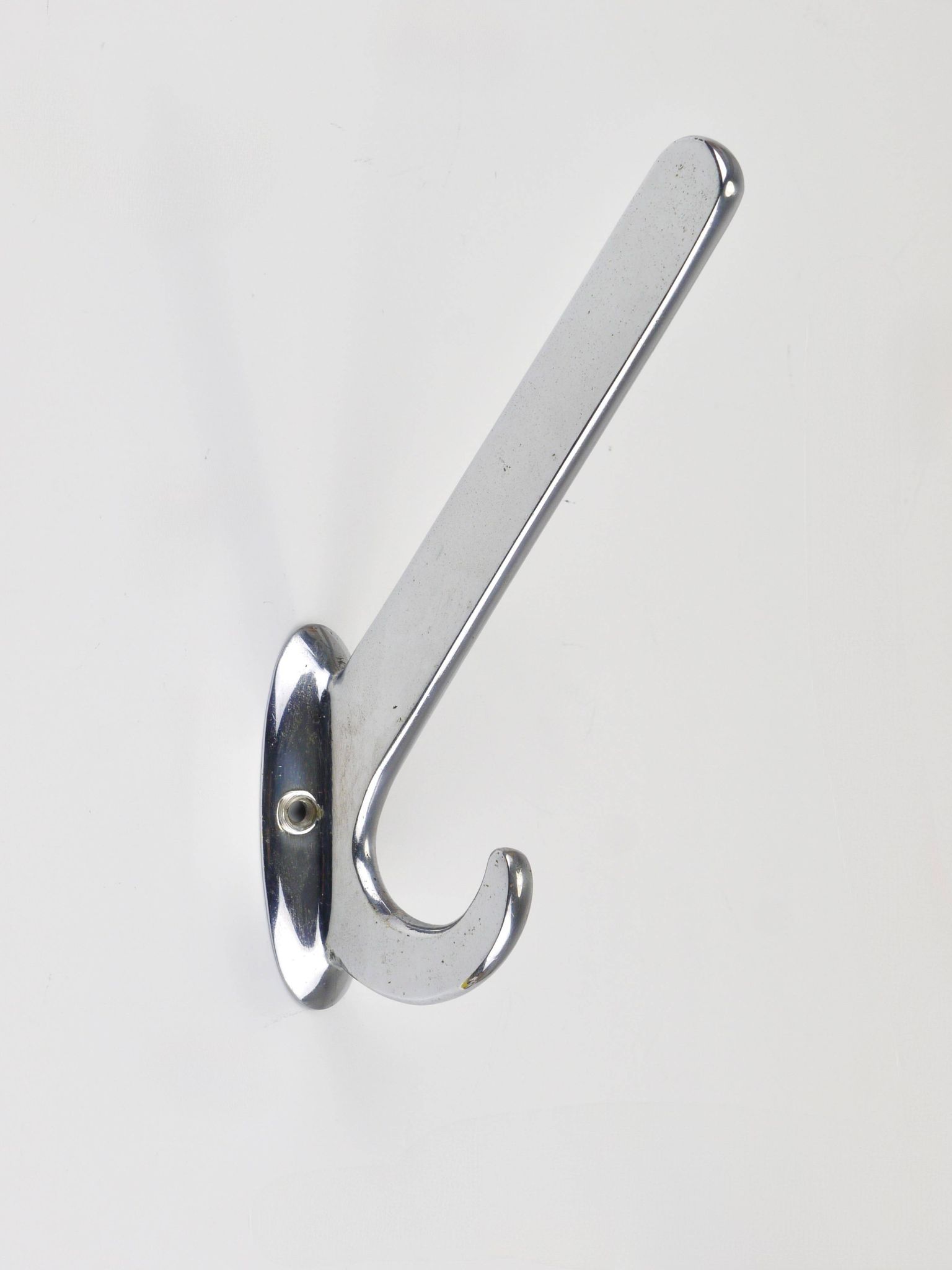 Up to 5 large Art Deco Bauhaus wall hooks in nickel and brass, Vienna, 1930s.