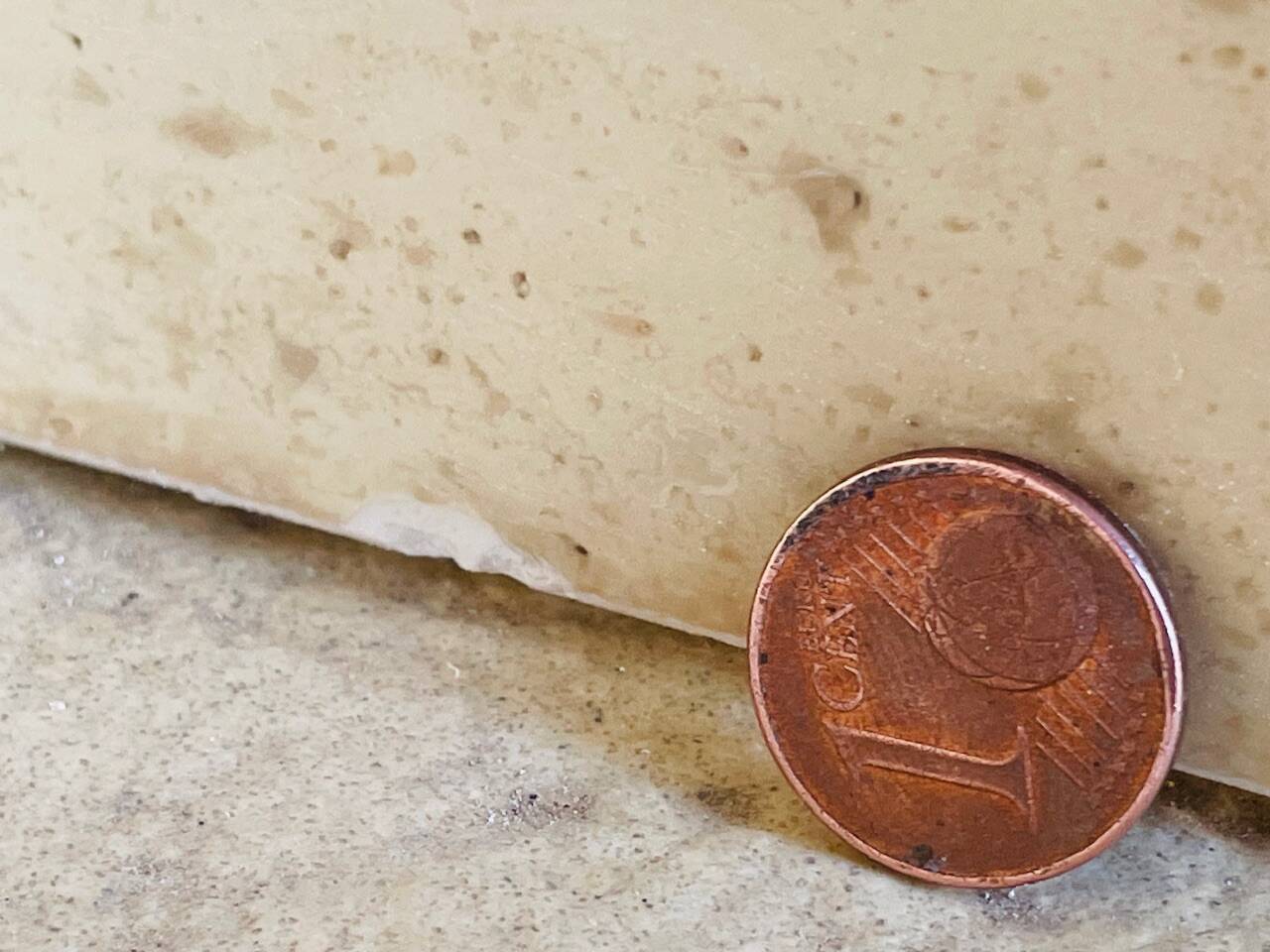 Vintage side table in travertine, circa 1980s.