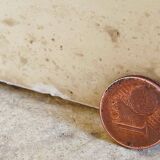 Vintage side table in travertine, circa 1980s.