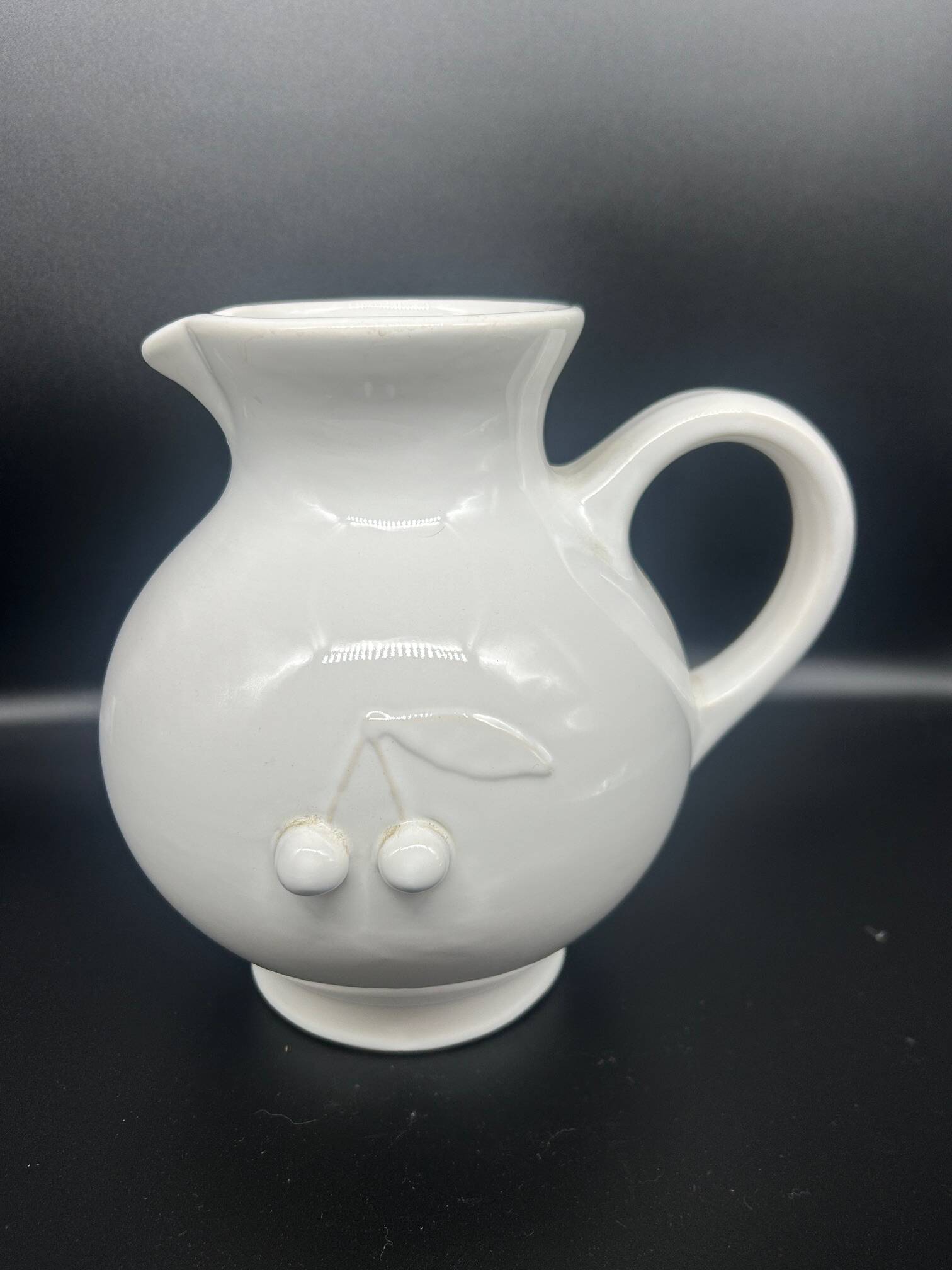 white ceramic cherry jug