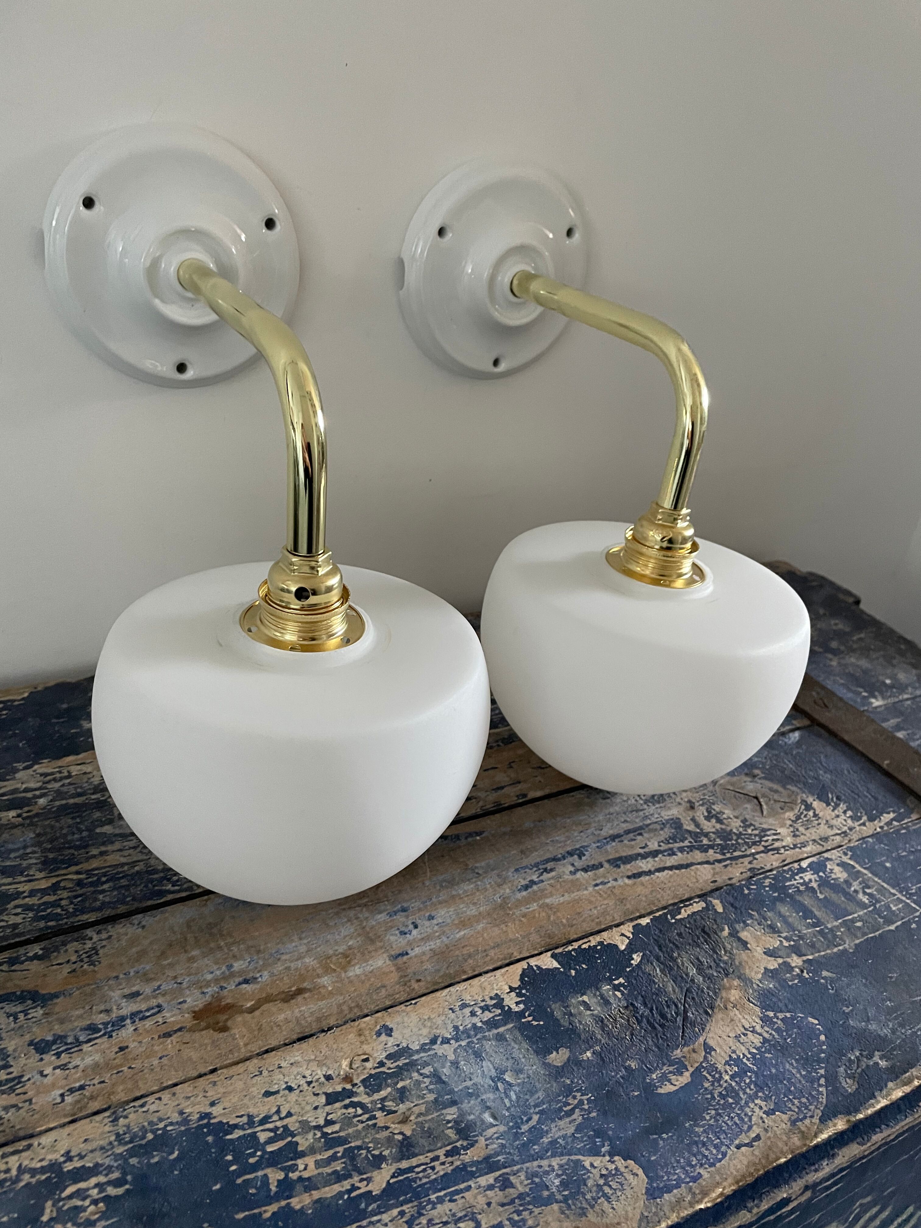 Set of two electrified white opaline wall lamps to nine