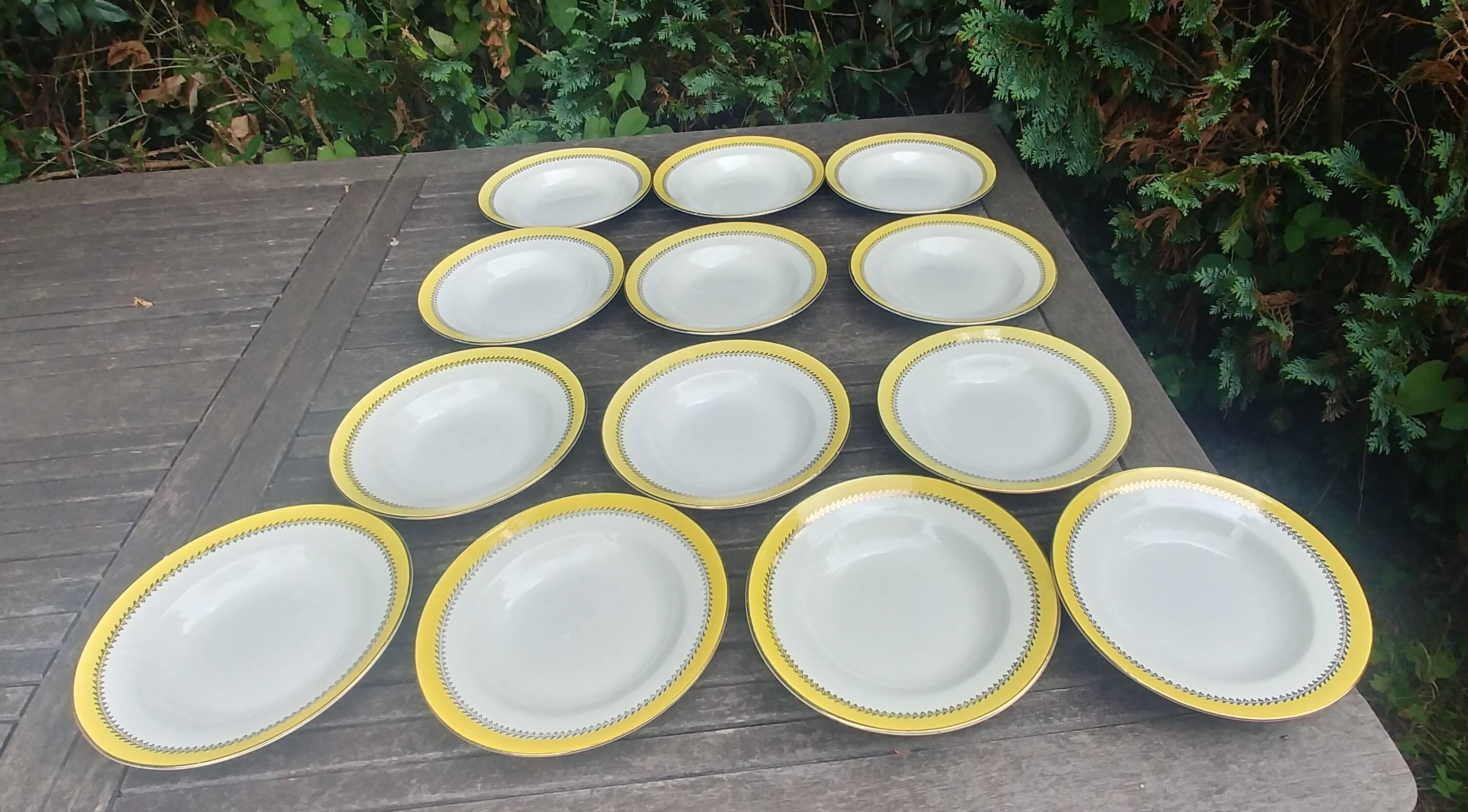 Set of thirteen old porcelain soup plates signed "Biarritz"