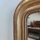 Louis Philippe gilded mirror with gendarme hat nineteenth H:130cm