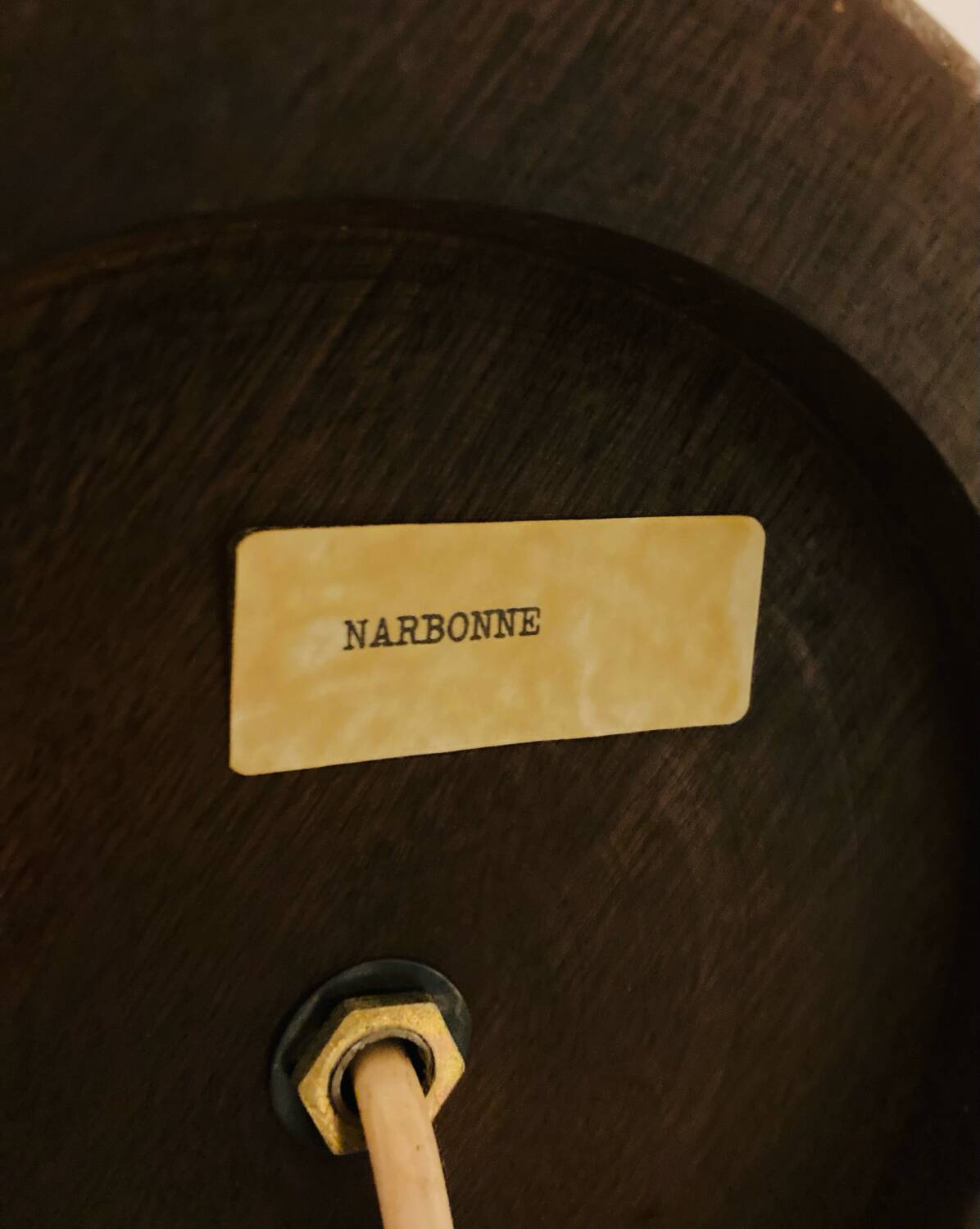 1980s ceramic table lamp with a wooden base and adjustable shade.