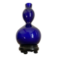 Vase opaline bleue, socle bois