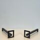 Pair of modernist andirons in steel and wrought iron