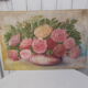 Tableau of a bouquet of flowers on a double-sided wooden panel.