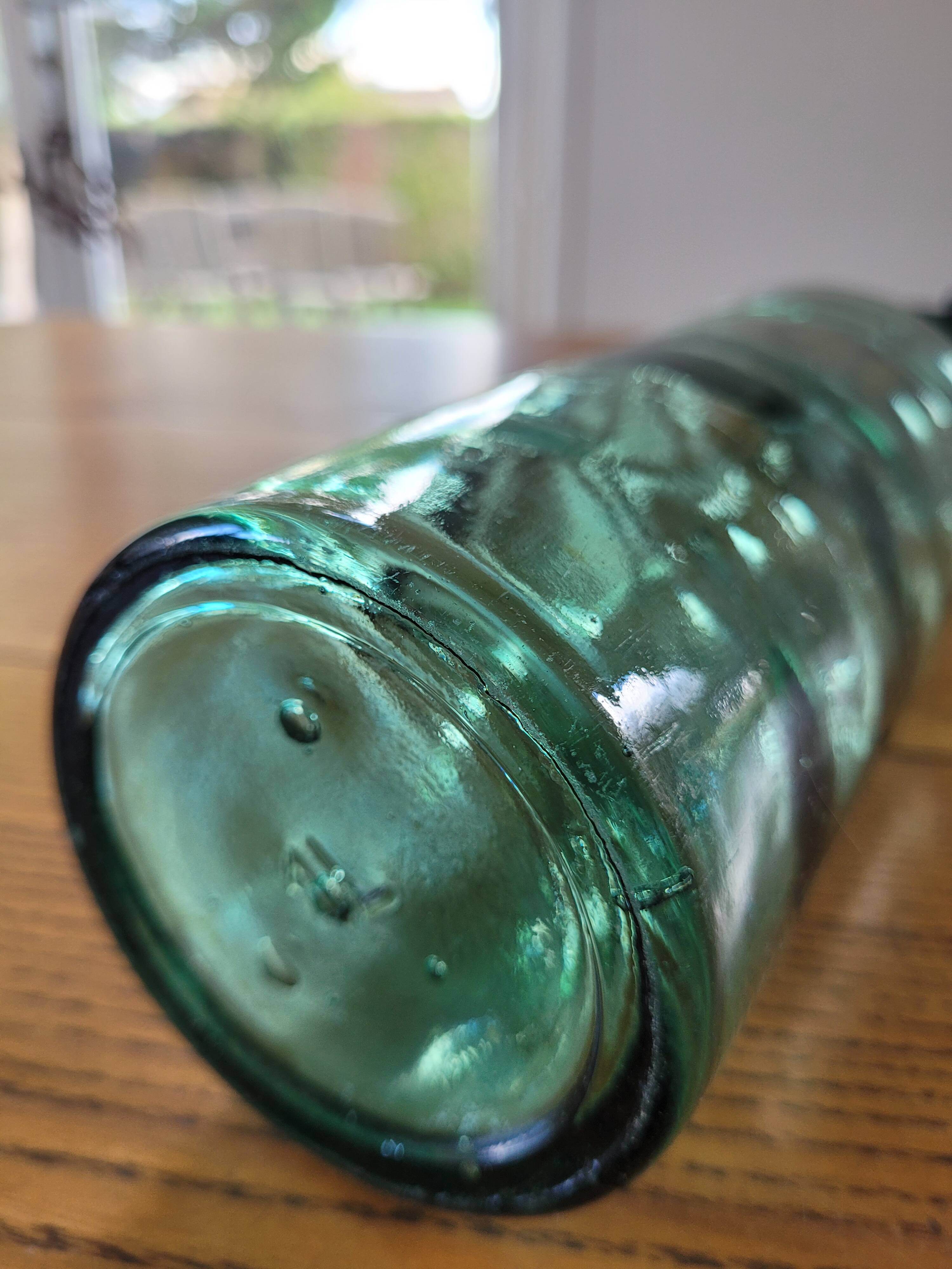 Vintage glass bottle l'Idéale with porcelain stopper