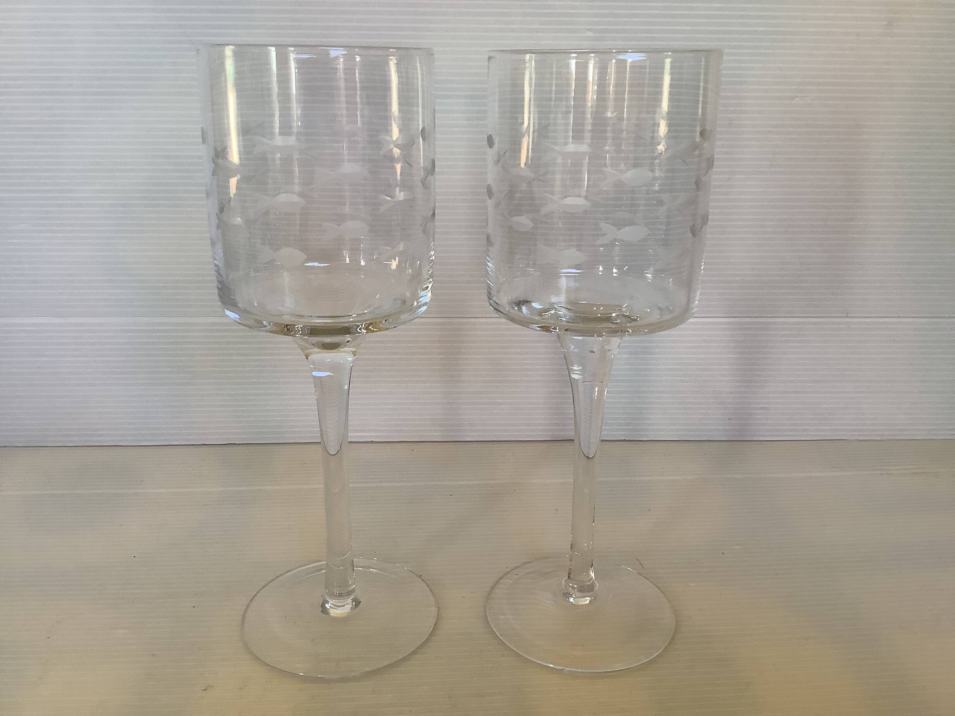 Duo of cut glass fish candle holders