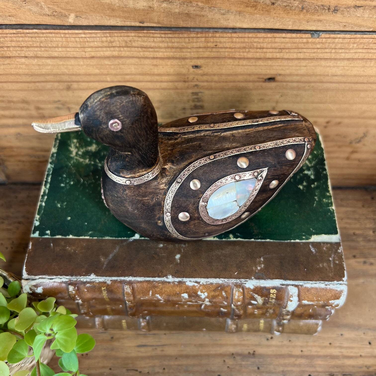 Bird in dark wood, brass & mother-of-pearl