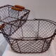 Duo of aged metal mesh baskets