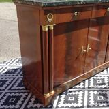 Flamed mahogany enfilade with sea green marble in Empire style.