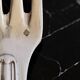 24 silver-plated metal table settings in the filet model.