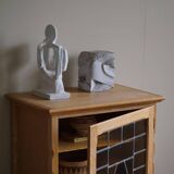 Scandinavian wardrobe in natural oak with a glass front.