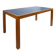 Pine table with a top covered in linoleum.