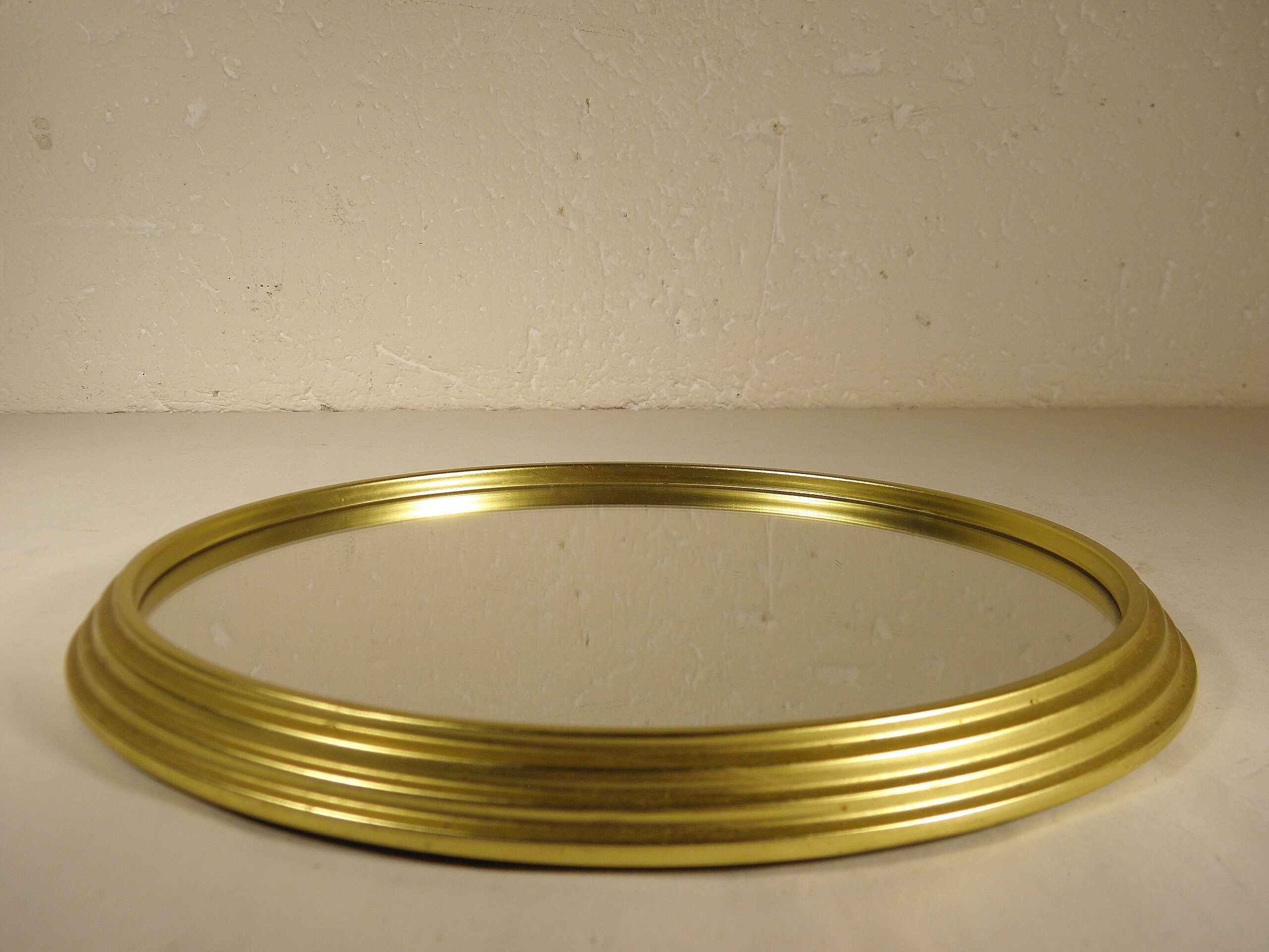 Golden round mirror