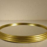Golden round mirror