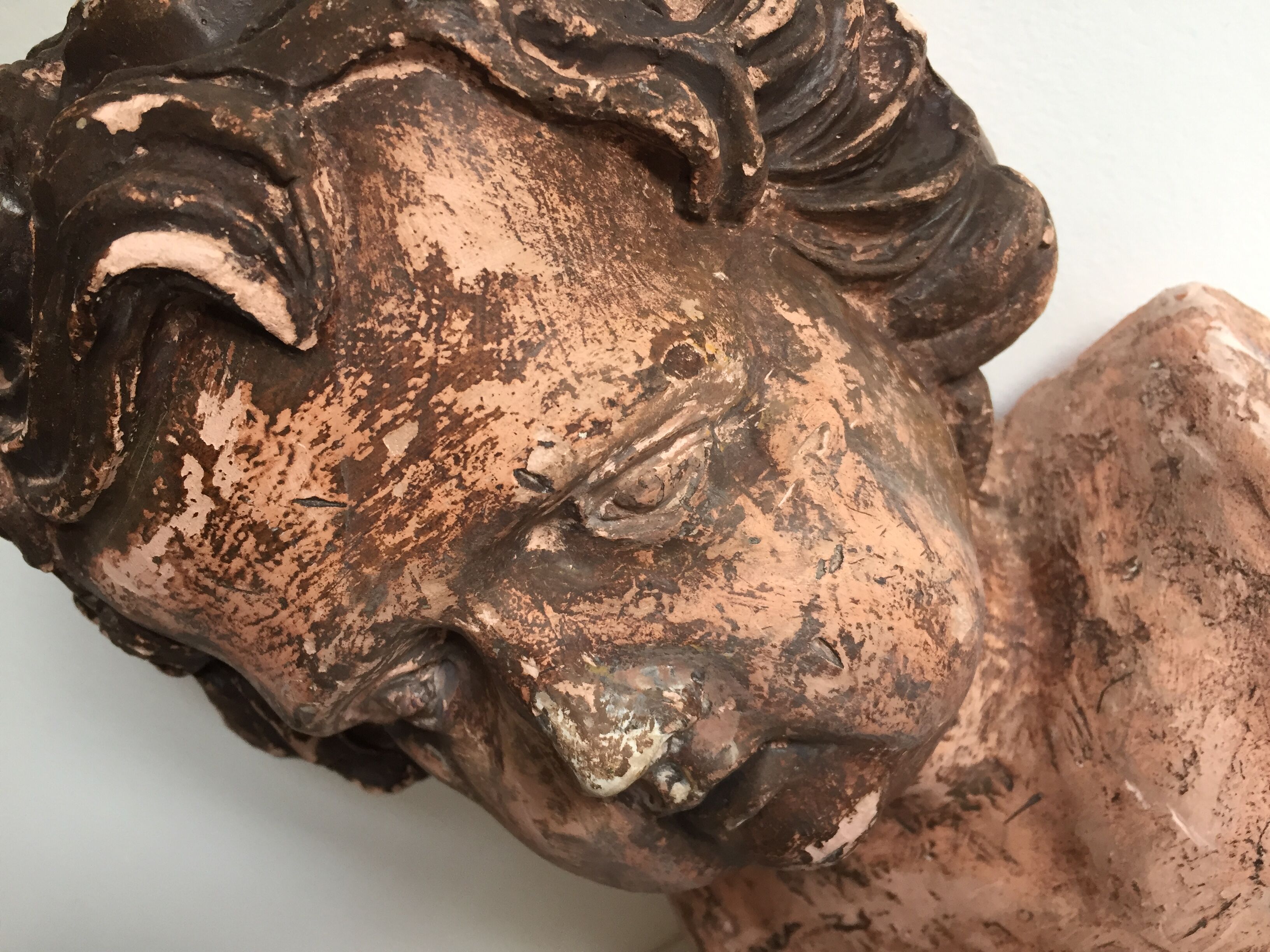 Bust old child in plaster stamped l.j.c.