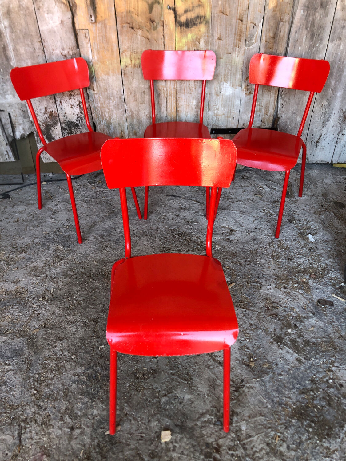 Set of 4 red metal chairs