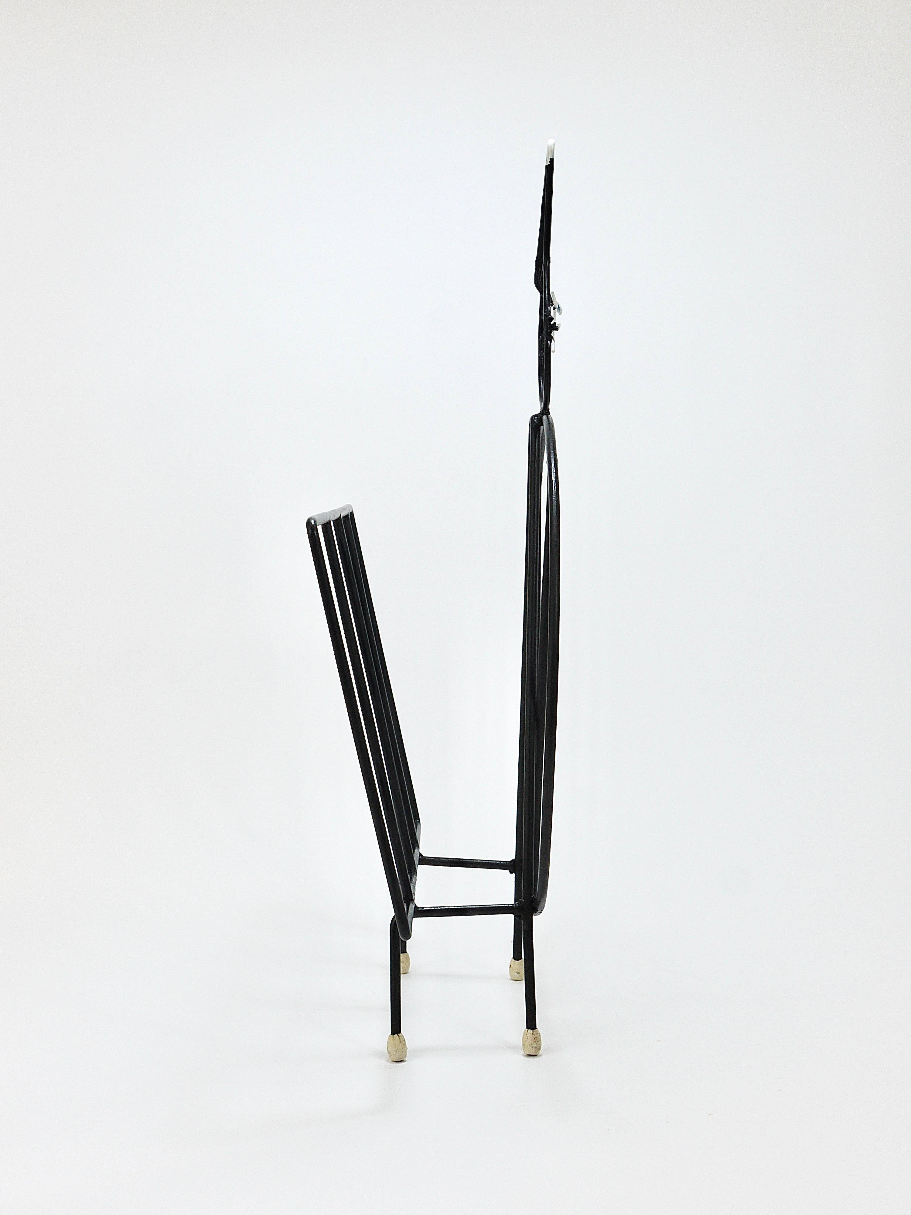 Mid-century cat-shaped magazine or record holder, iron, Italy, 1950s.