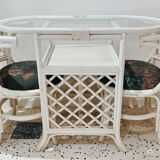 Rattan head-to-head table with vintage armchairs