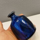 A small vase with blue running glaze with a ‘thin’ neck, from Swedish Kjell Sunesson