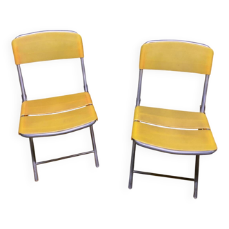 Yellow plastic and steel folding chairs, 1970s