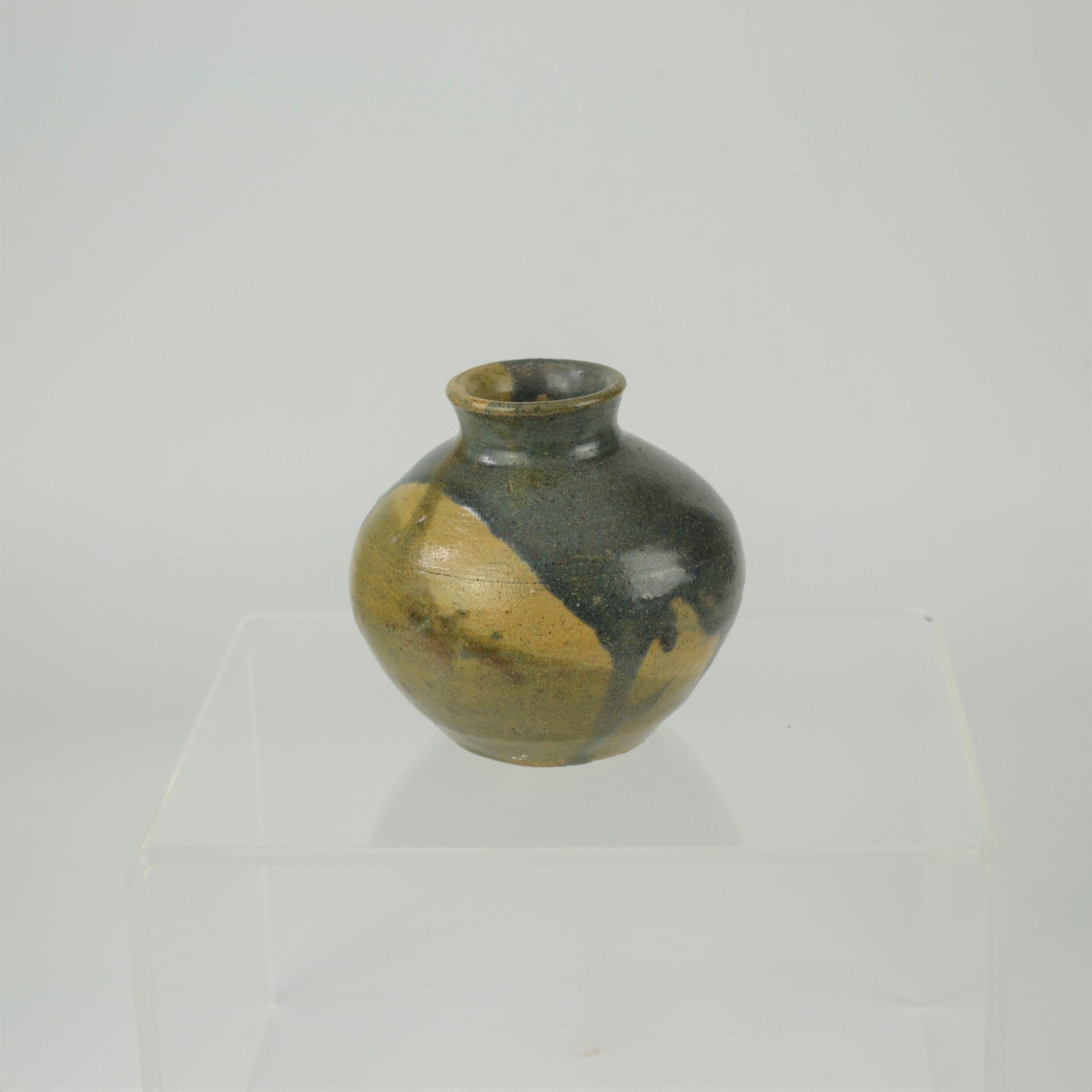 Sandstone ball vase by Eugène Lion